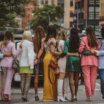 well-dressed women posing in street