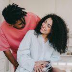 man smiling at smiling woman